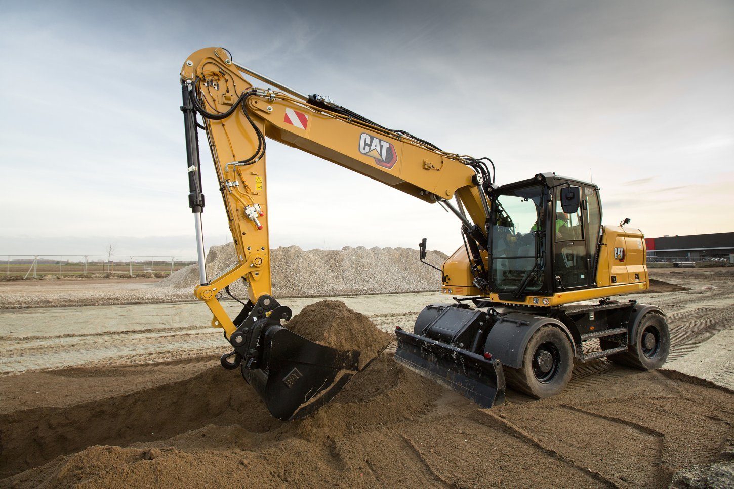 Machine using hydraulics to lift bucket