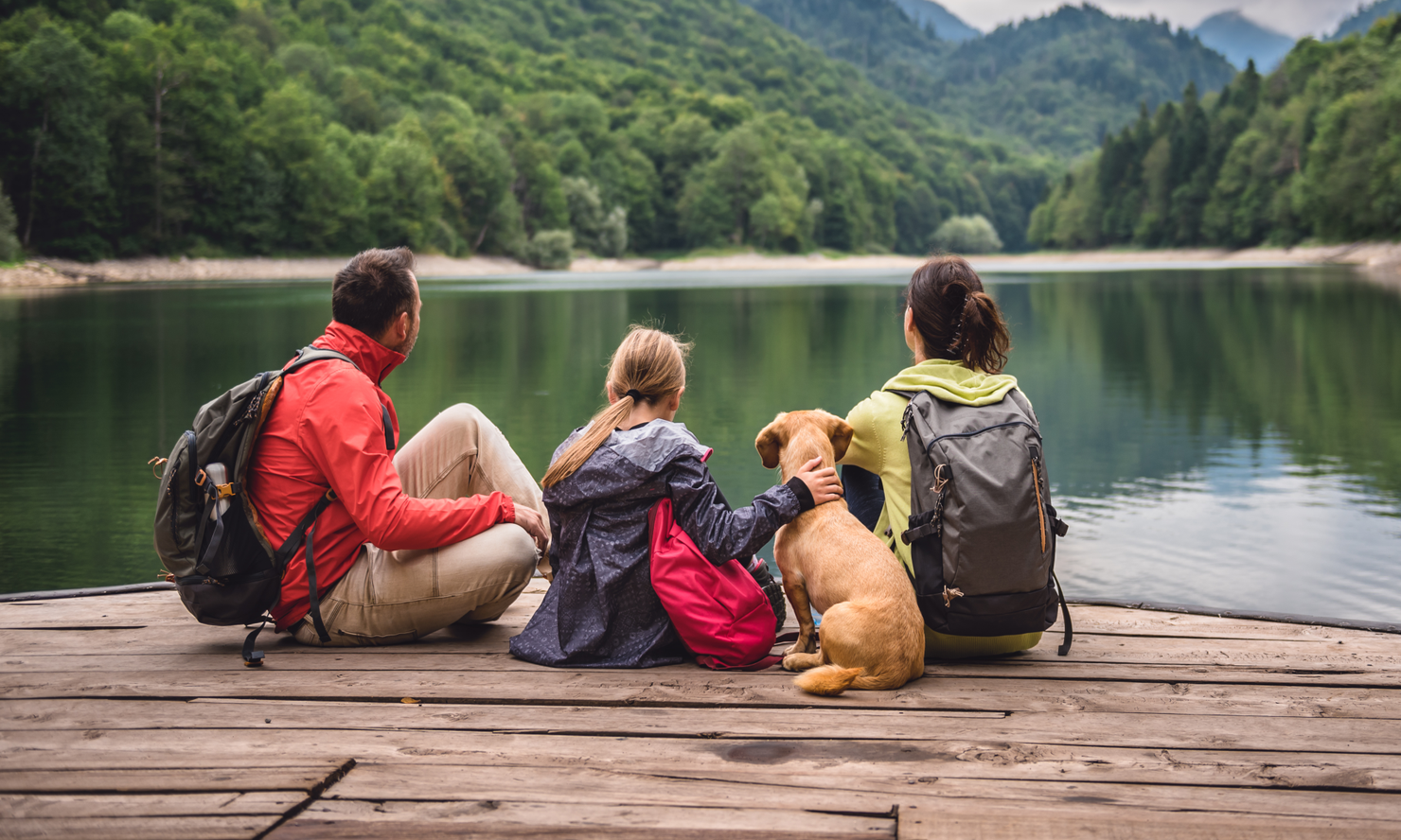 Family on Vacation Looking at Lake Mountains