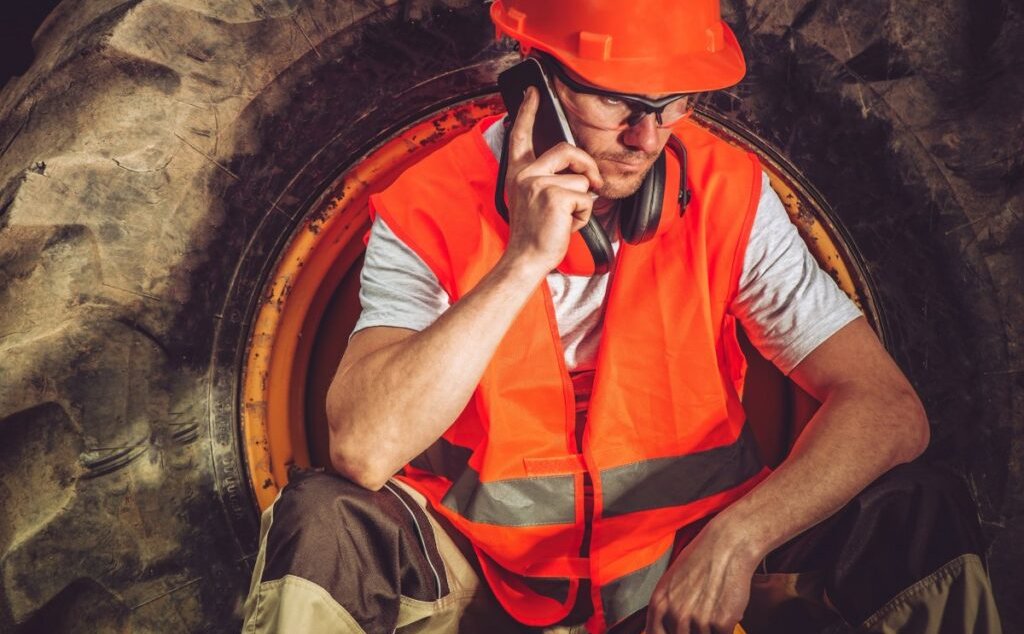 Machine Operator on Cell Phone