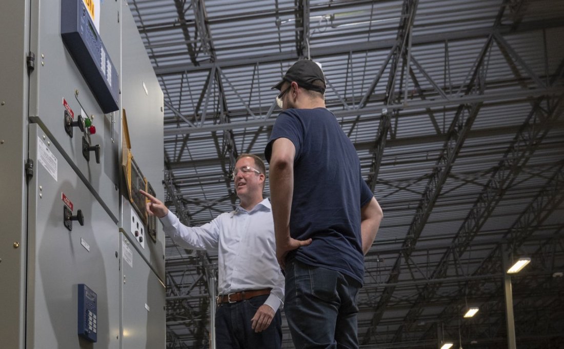 Men Discussing Switchgear